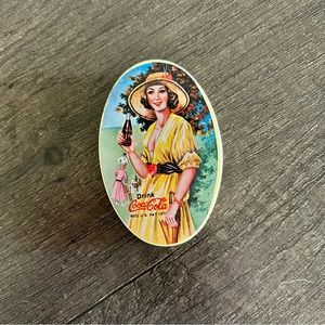 Pocket-sized vintage Coca Cola sewing kit in tin